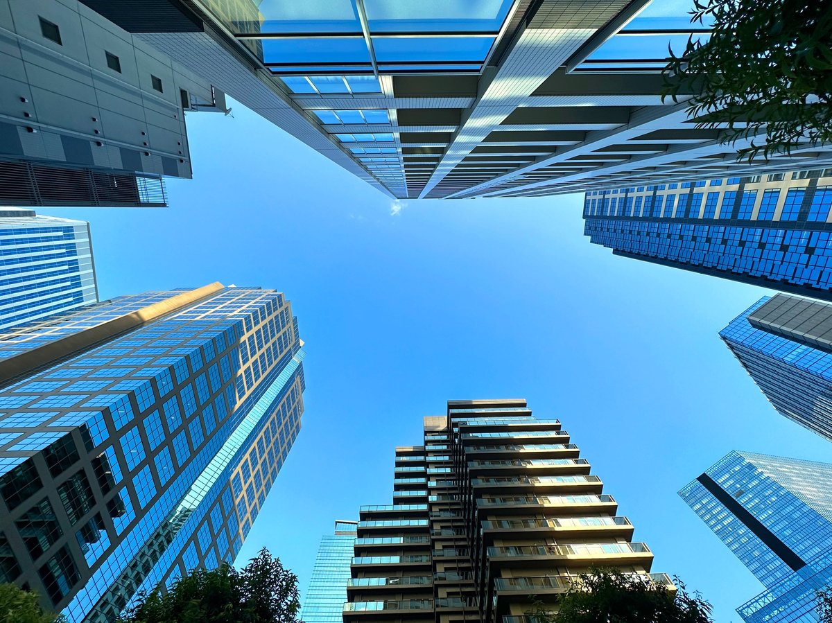 Modern residential building with blue sky, representing quality real estate